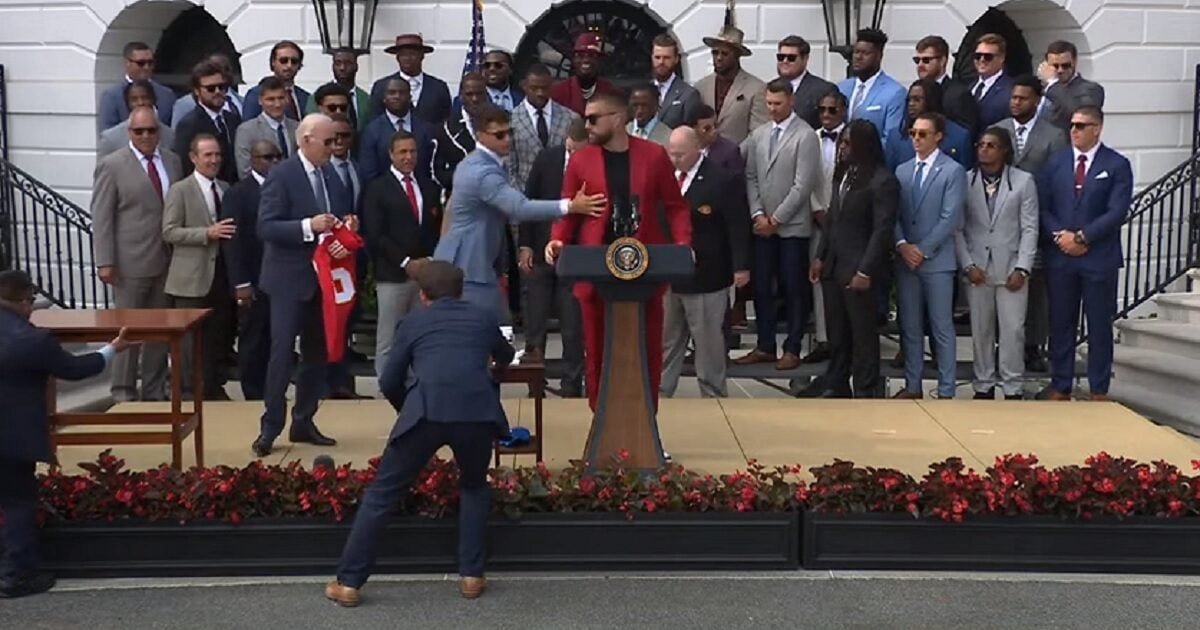 Chiefs Star Travis Kelce Tells Biden, 'Stay Right There,' Then Tries to Commandeer His Podium