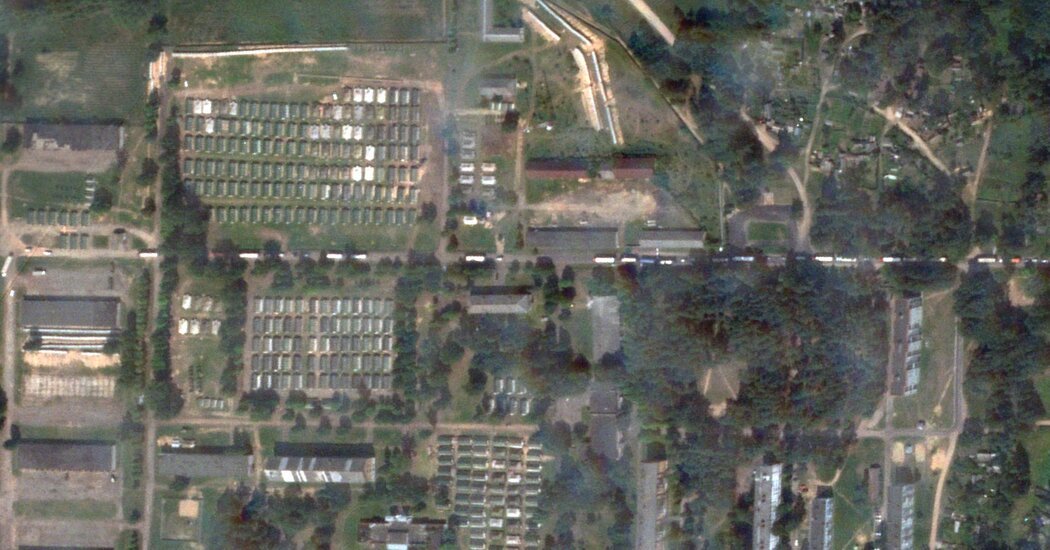 A large Wagner convoy arrives at a camp in Belarus.